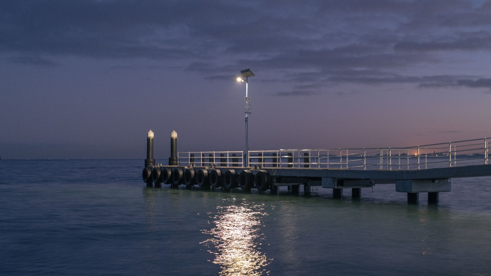 SOLANOVA overhead Solar Street Lights on a jetty pontoon.